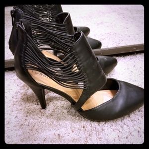 Closed pointy toe strappy heel